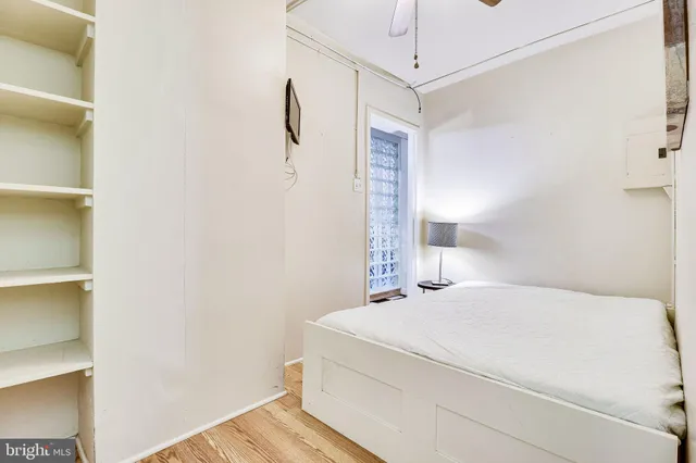 a bathroom with a sink mirror and shower