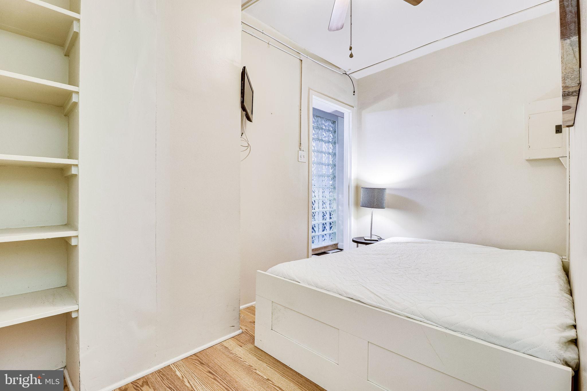 1111 Arlington Boulevard, Unit 812 Arlington, VA 22209 - Photo 28 of 37 a bedroom with a bed and a window