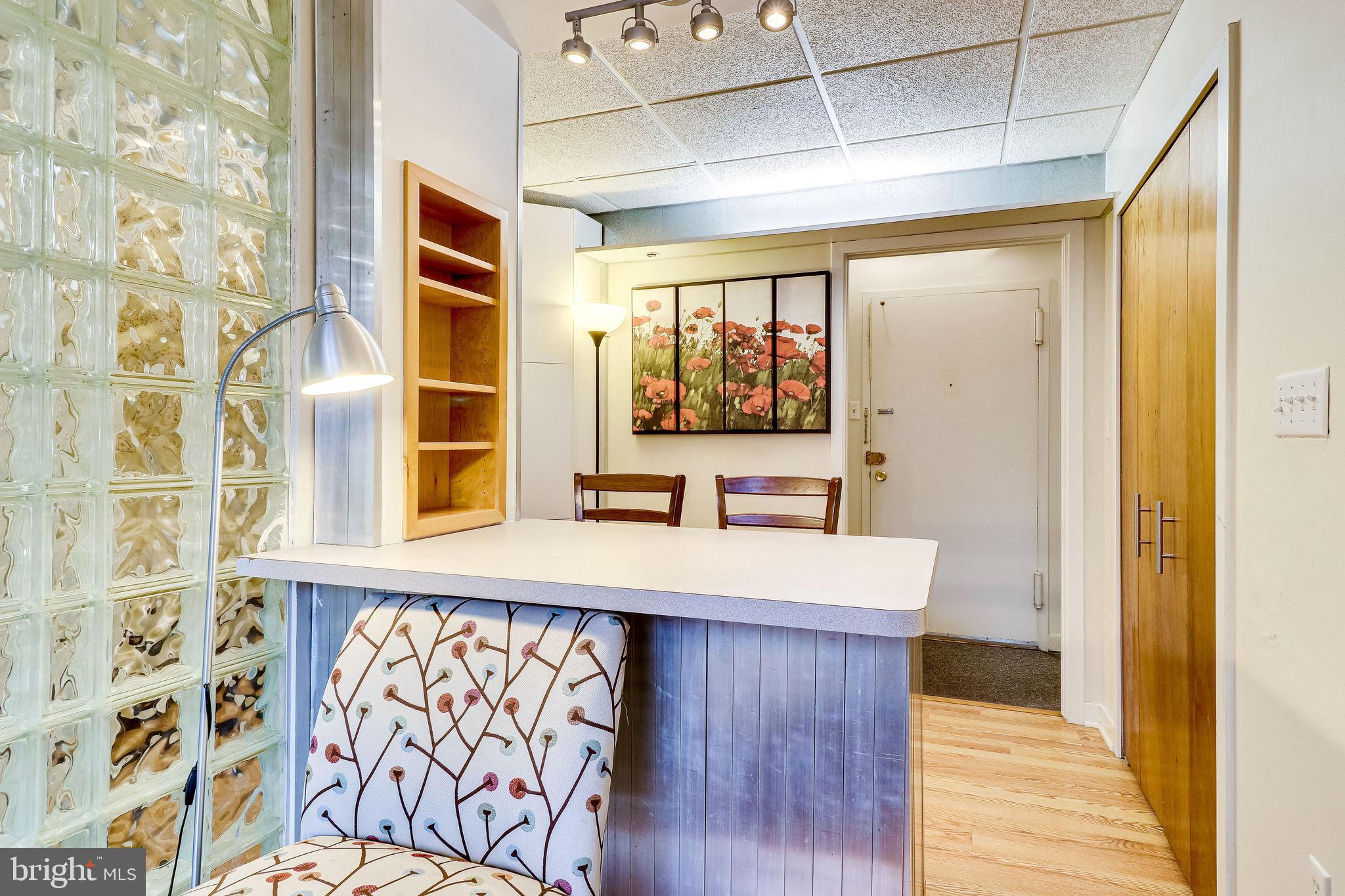 1111 Arlington Boulevard, Unit 812 Arlington, VA 22209 - Photo 4 of 37 a view of a kitchen with wooden floor and a window