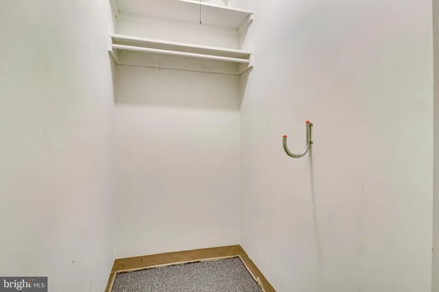 a view of a livingroom with furniture and hardwood floor