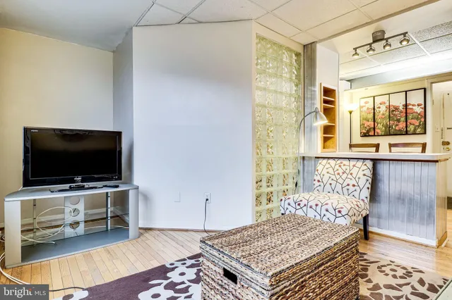 a living room with a couch and a flat screen tv