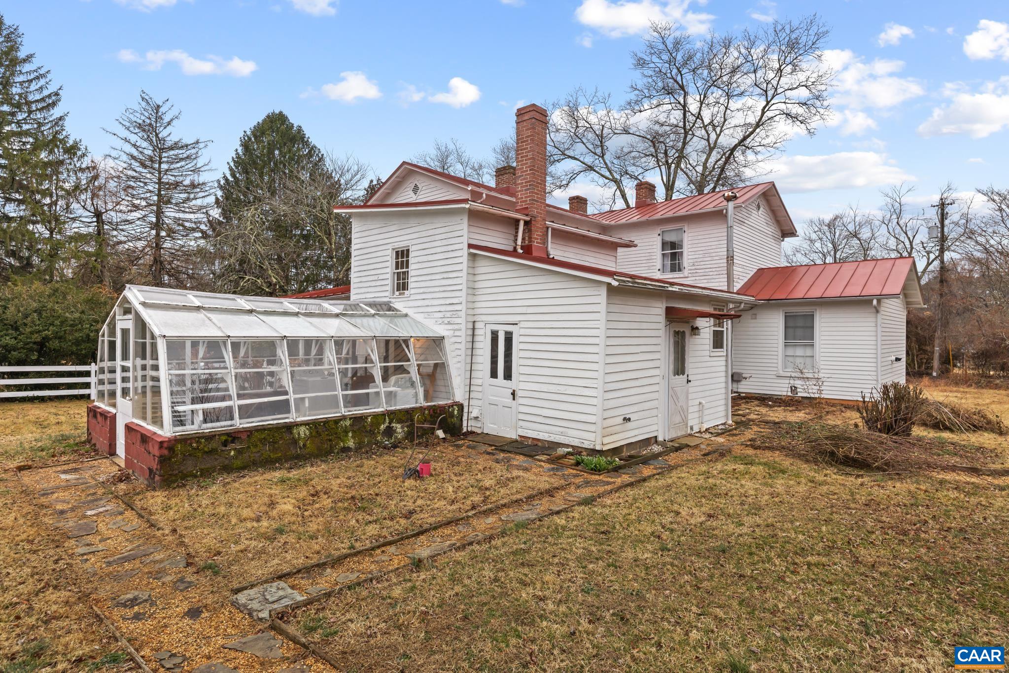 9451 Black Walnut Run Road Rhoadesville, VA 22542 - Photo 11 of 72 a view of a house with a yard and sitting area