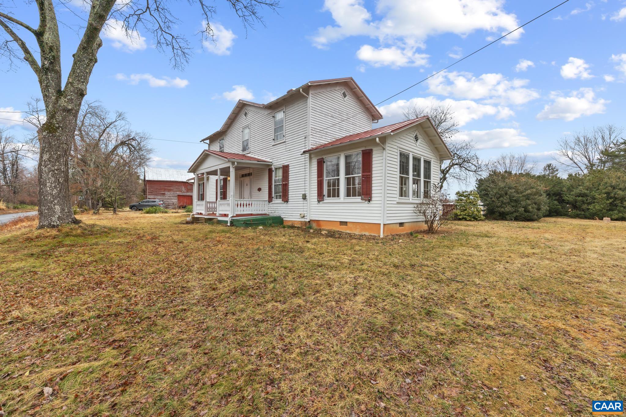 9451 Black Walnut Run Road Rhoadesville, VA 22542 - Photo 12 of 72 a front view of a house with a yard