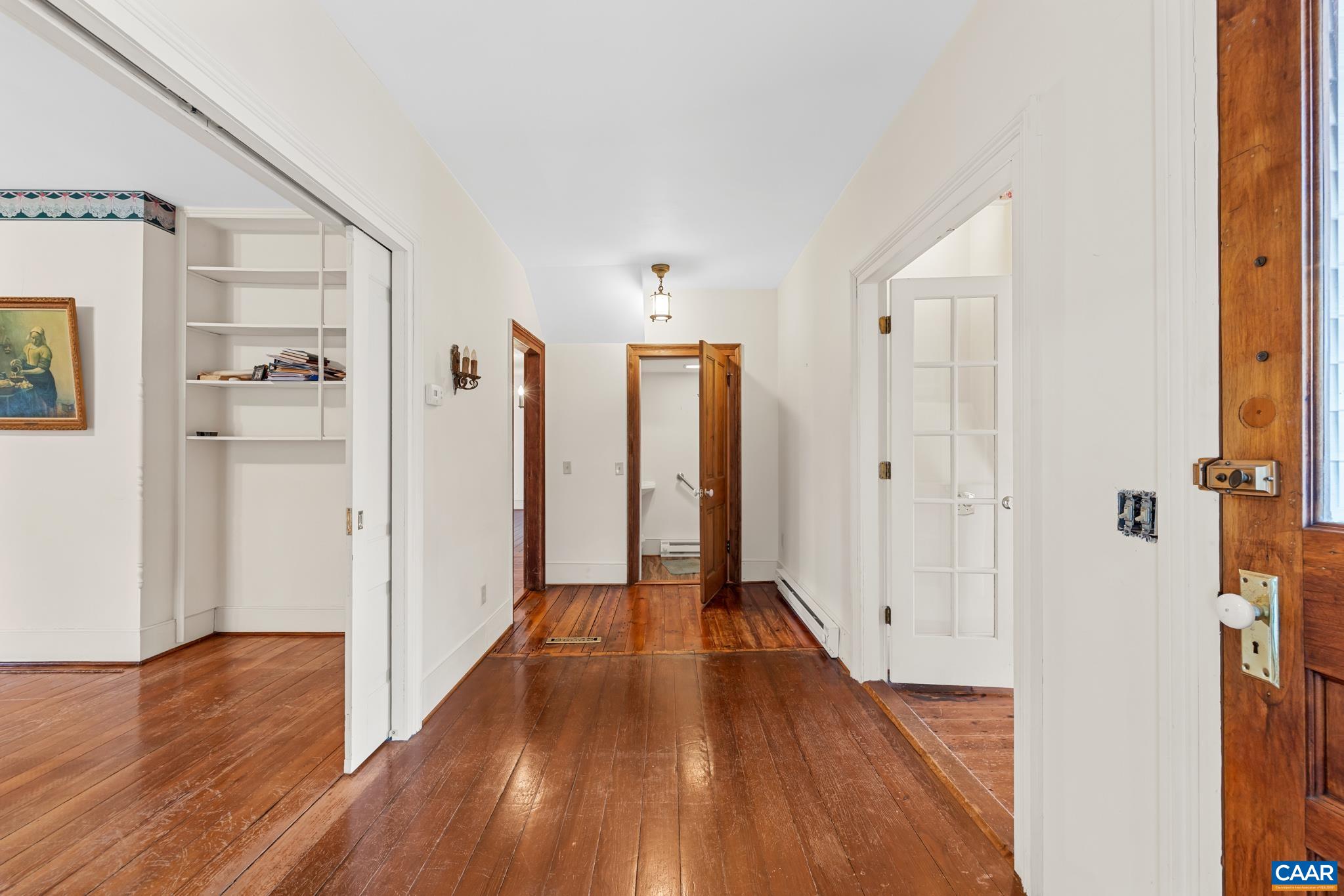 9451 Black Walnut Run Road Rhoadesville, VA 22542 - Photo 22 of 72 a view of a hallway with wooden floor and closet area