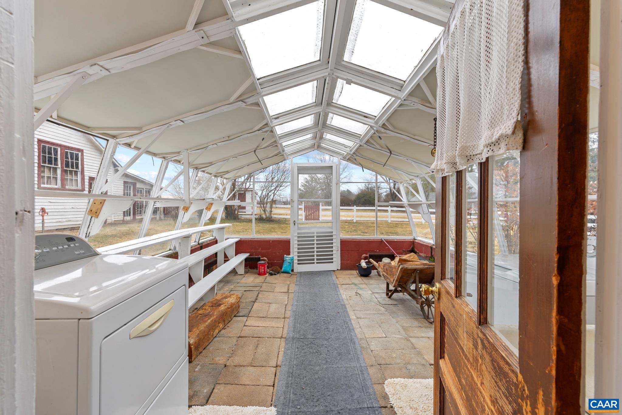 9451 Black Walnut Run Road Rhoadesville, VA 22542 - Photo 28 of 72 a lobby with furniture and a chandelier