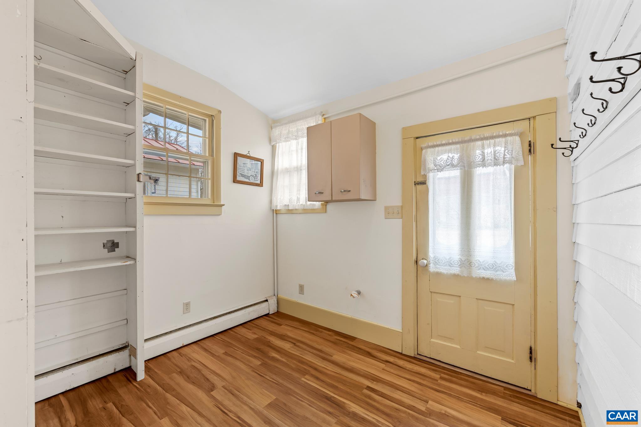 9451 Black Walnut Run Road Rhoadesville, VA 22542 - Photo 32 of 72 a view of empty room with wooden floor and entryway