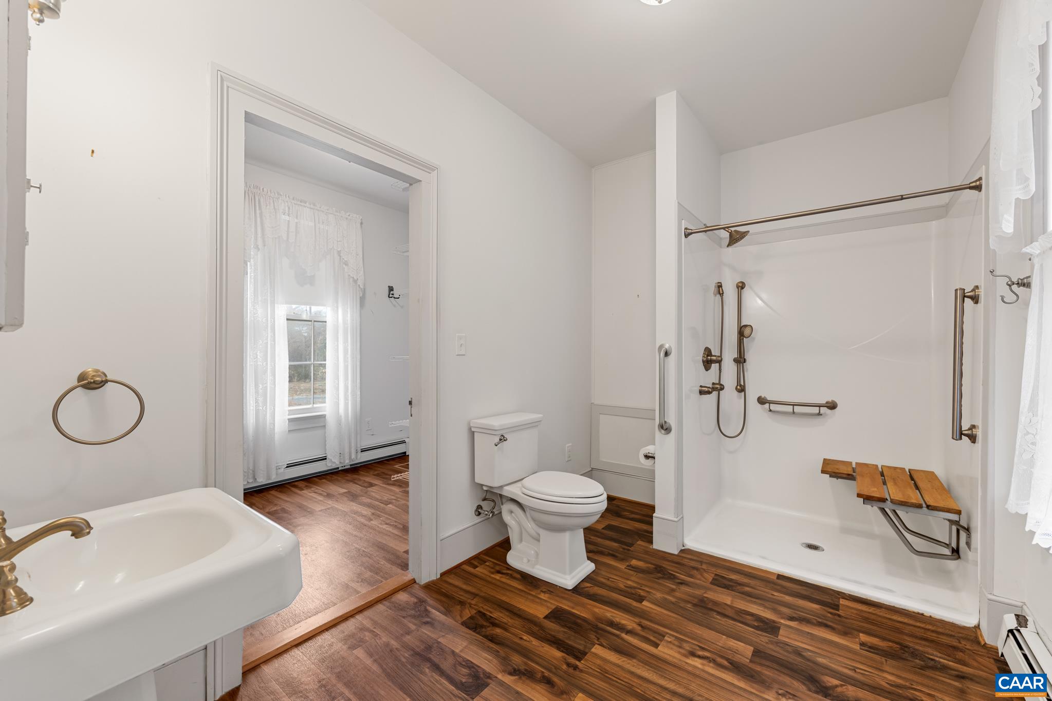 9451 Black Walnut Run Road Rhoadesville, VA 22542 - Photo 36 of 72 a bathroom with a sink toilet and shower