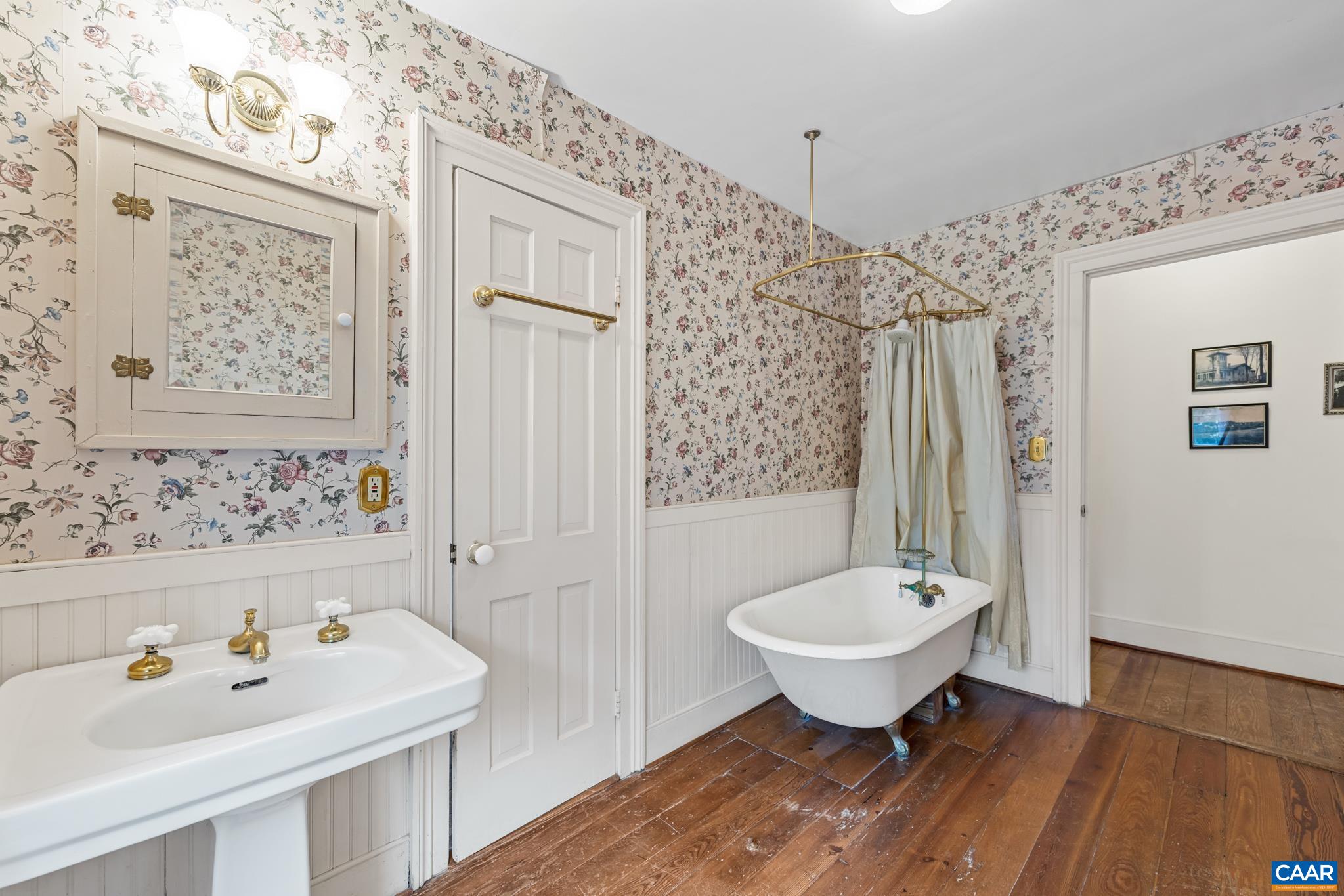 9451 Black Walnut Run Road Rhoadesville, VA 22542 - Photo 47 of 72 a bathroom with a sink and a mirror