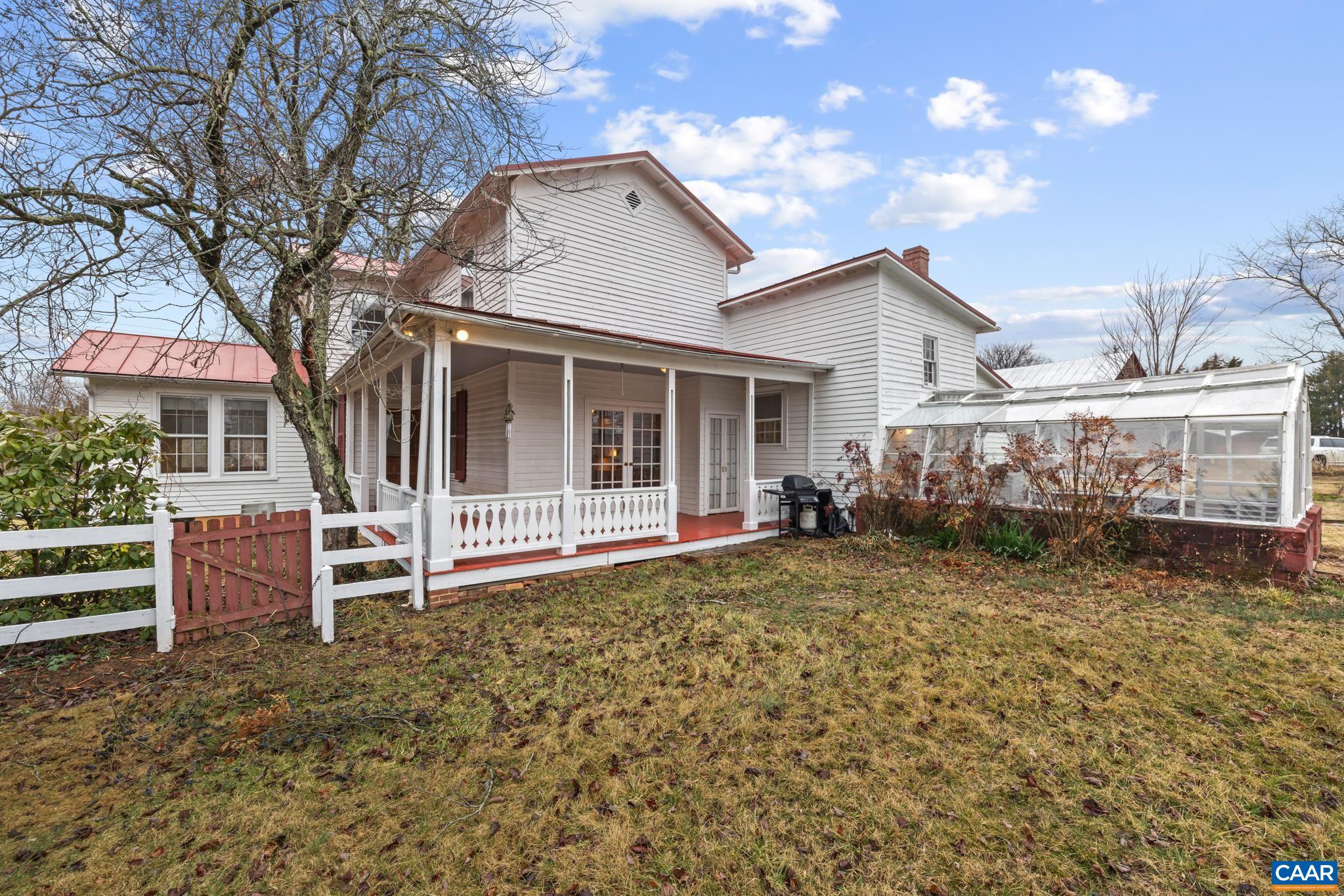 9451 Black Walnut Run Road Rhoadesville, VA 22542 - Photo 8 of 72 a view of a house with a yard