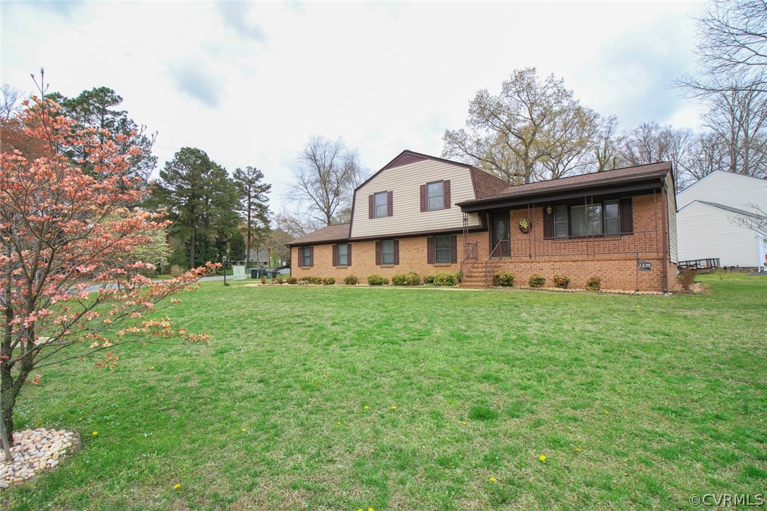 a front view of a house with a garden