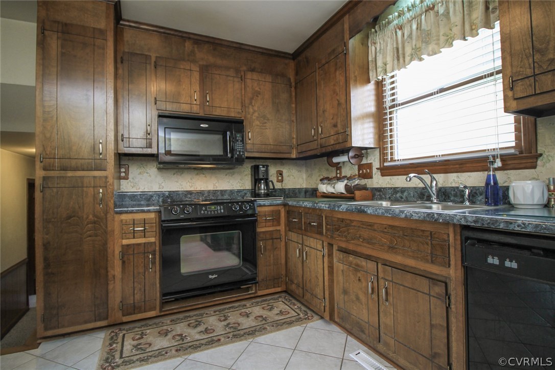 1500 Austin Road Chester, VA 23836 - Photo 15 of 30 a kitchen with stainless steel appliances granite countertop a stove a sink and a microwave