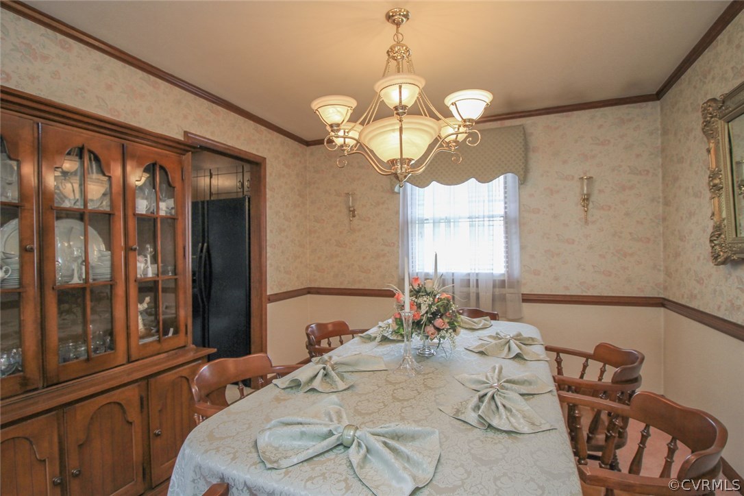 1500 Austin Road Chester, VA 23836 - Photo 18 of 30 a view of a dining room with furniture a chandelier and large windows
