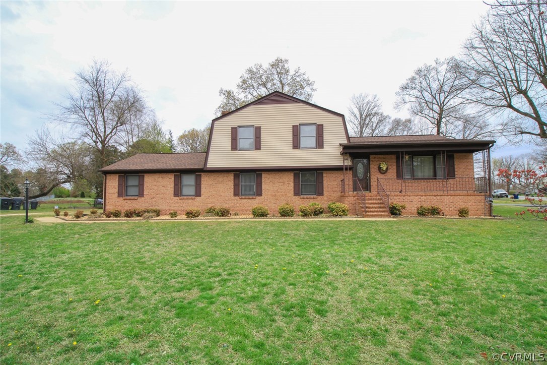 1500 Austin Road Chester, VA 23836 - Photo 2 of 30 a front view of a house with a yard and trees