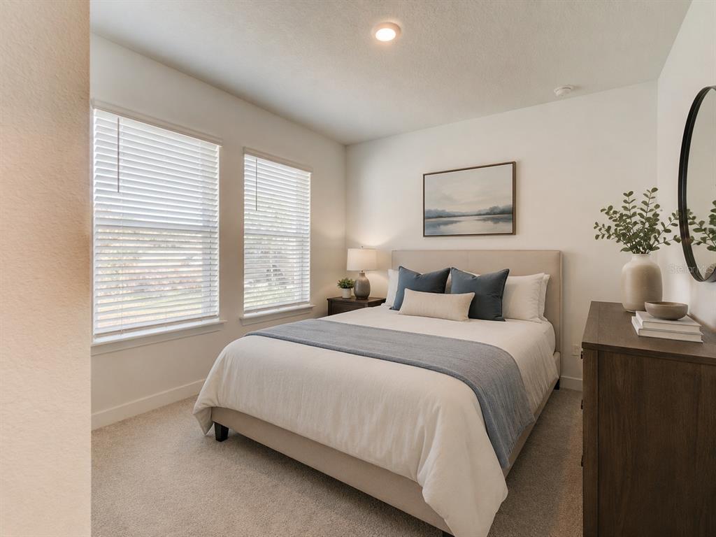 176 Jones Fish Camp Road Edgewater, FL 32141 - Photo 12 of 30 a bedroom with bed and a window