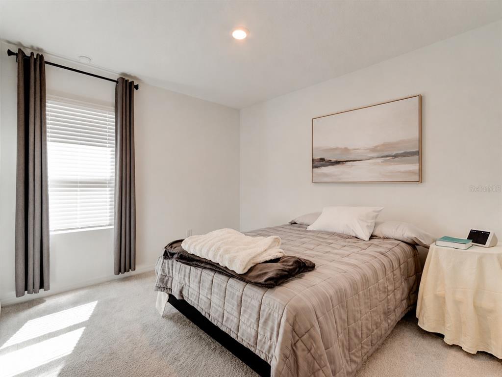 176 Jones Fish Camp Road Edgewater, FL 32141 - Photo 15 of 30 a bedroom with a bed and a window
