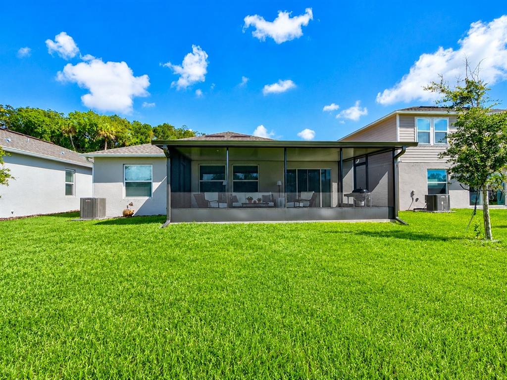 176 Jones Fish Camp Road Edgewater, FL 32141 - Photo 19 of 30 a front view of house with yard and outdoor seating