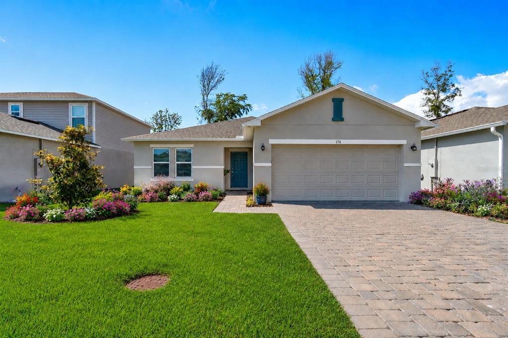 176 Jones Fish Camp Road Edgewater, FL 32141 - Photo 23 of 30 a front view of a house with a garden