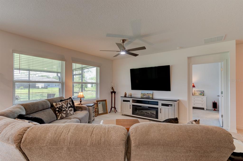 176 Jones Fish Camp Road Edgewater, FL 32141 - Photo 6 of 30 a living room with furniture and a flat screen tv