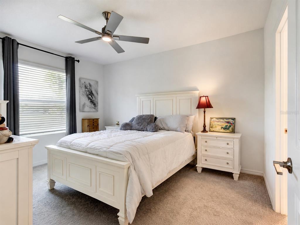 176 Jones Fish Camp Road Edgewater, FL 32141 - Photo 9 of 30 a bedroom with a bed and a dresser