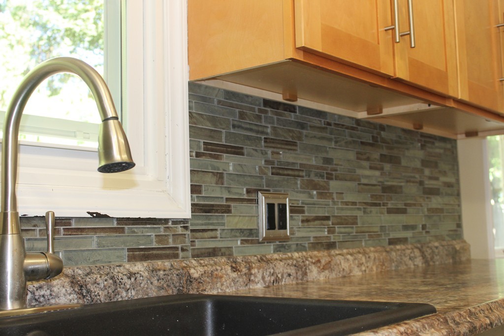 377 Stapleton Road Springfield, MA 01109 - Photo 4 of 17 a bathroom with a granite countertop sink and a mirror