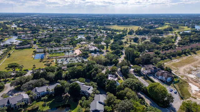 an aerial view of residential house with swimming pool and garden