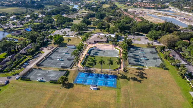 an aerial view of a swimming pool and outdoor space