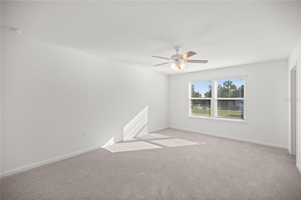 3339 Southeast 37th Ave Road Ocala, FL 34480 - Photo 11 of 21 a view of a livingroom with a ceiling fan and window