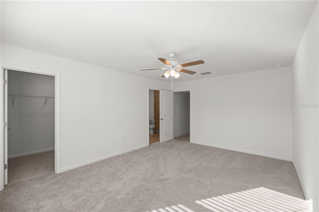 3339 Southeast 37th Ave Road Ocala, FL 34480 - Photo 12 of 21 a view of an empty room with a chandelier fan
