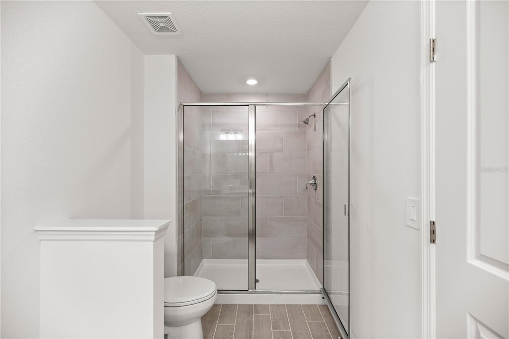 3339 Southeast 37th Ave Road Ocala, FL 34480 - Photo 15 of 21 a bathroom with a shower a toilet and a sink