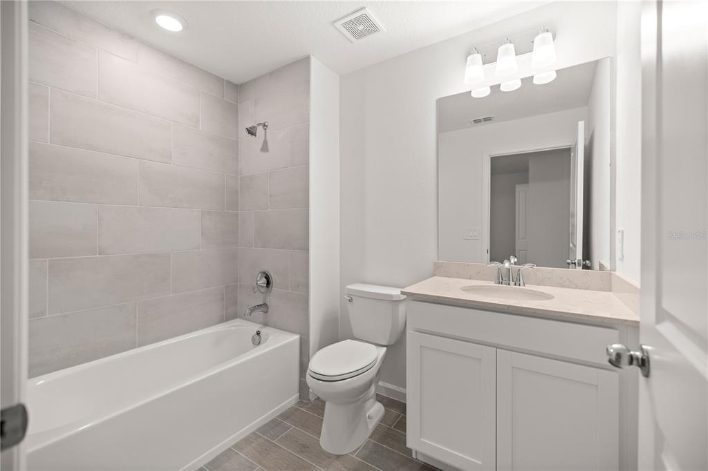 3339 Southeast 37th Ave Road Ocala, FL 34480 - Photo 17 of 21 a bathroom with a sink a toilet and shower
