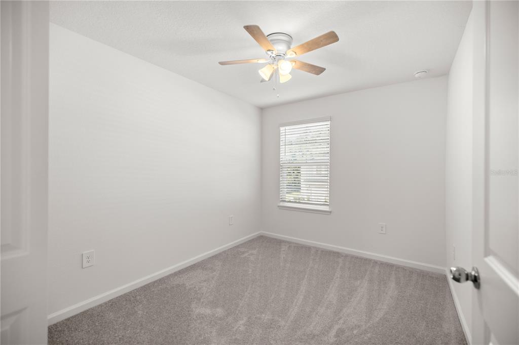 3339 Southeast 37th Ave Road Ocala, FL 34480 - Photo 18 of 21 an empty room with a window