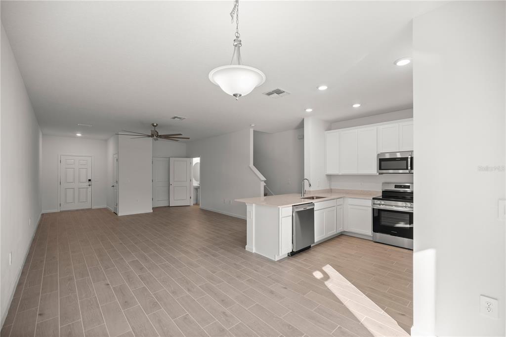 3339 Southeast 37th Ave Road Ocala, FL 34480 - Photo 6 of 21 a view of kitchen with sink and microwave