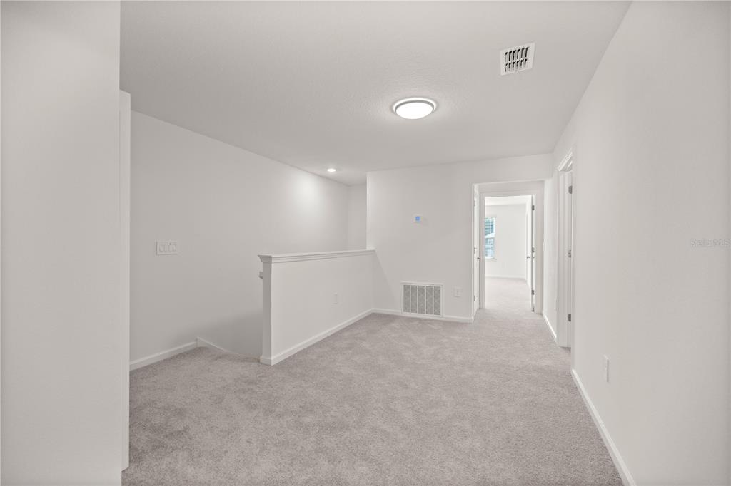 3339 Southeast 37th Ave Road Ocala, FL 34480 - Photo 9 of 21 an empty room with white walls and white walls