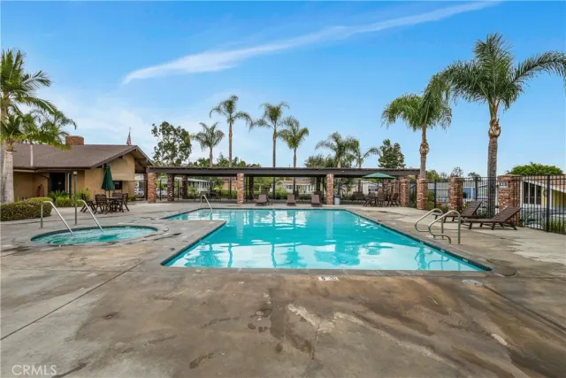a front view of house with yard and outdoor seating
