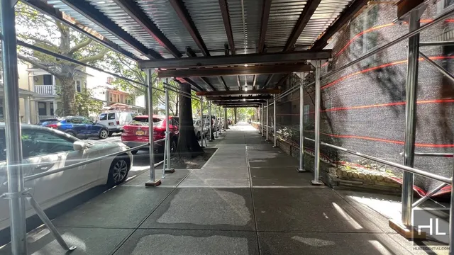 a view of street with a bike and car