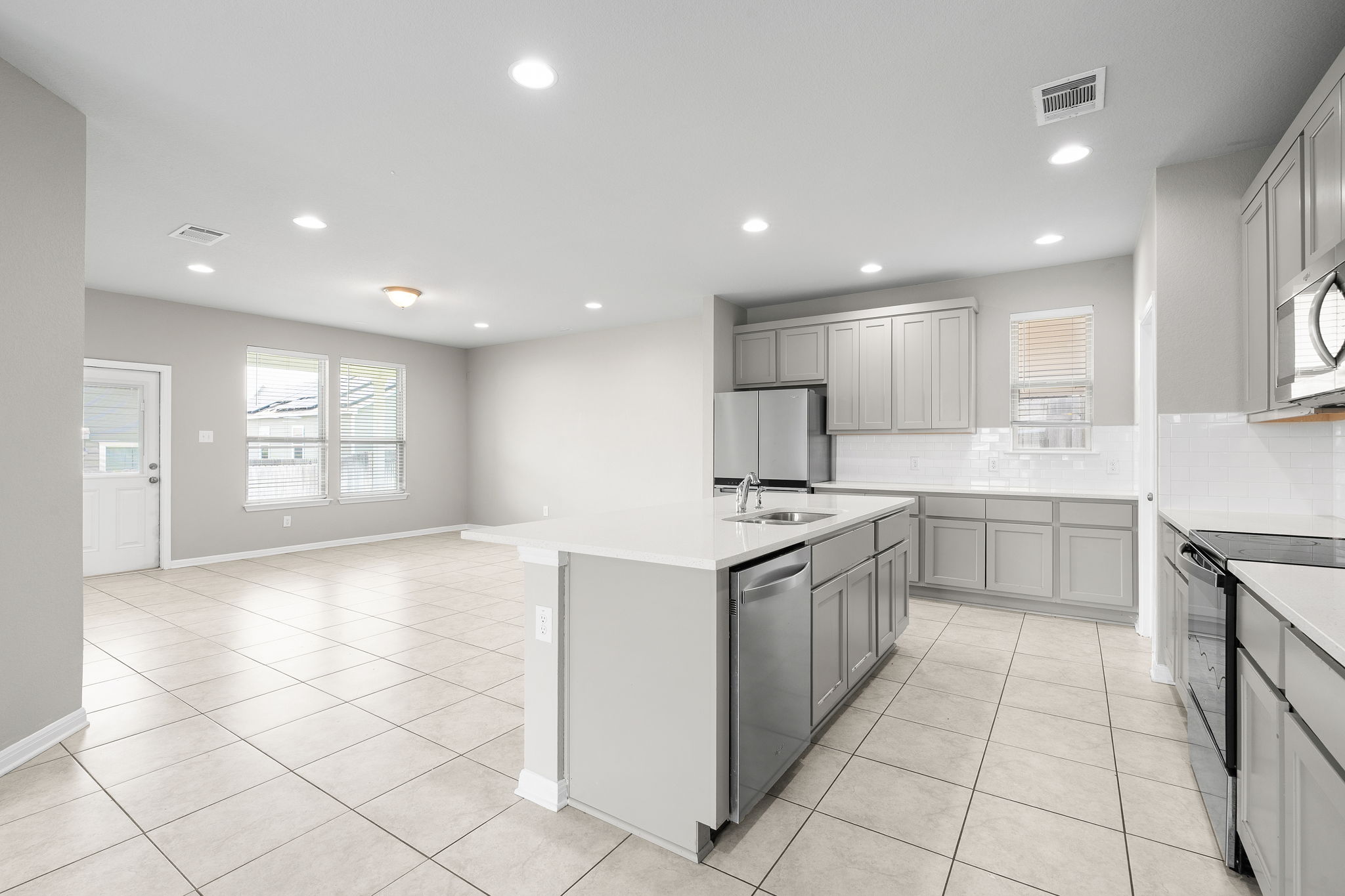 313 Mclintock Road Jarrell, TX 76537 - Photo 16 of 40 A pristine open-concept kitchen and living area, perfect for daily living and entertaining.