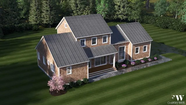 a aerial view of a house next to a big yard