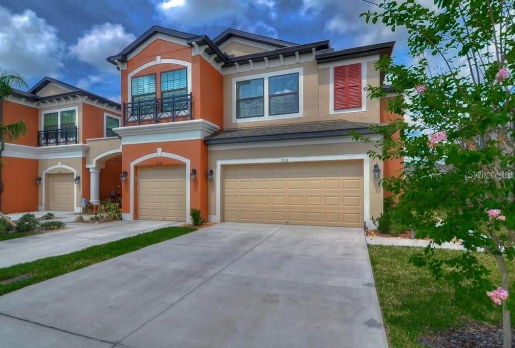 9135 Fox Sparrow Road Tampa, FL 33626 - Photo 1 of 1 a front view of a house with a yard and garage