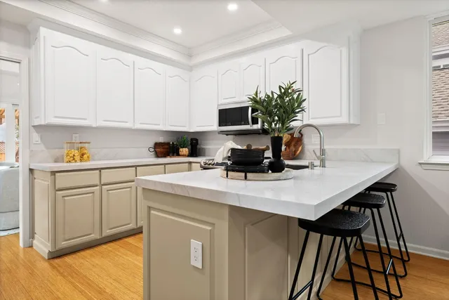 a dining room with furniture and wooden floor