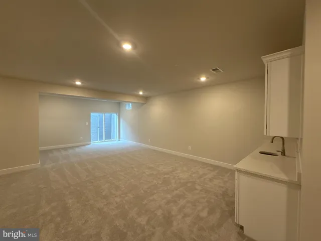 a view of a storage & utility room with windows