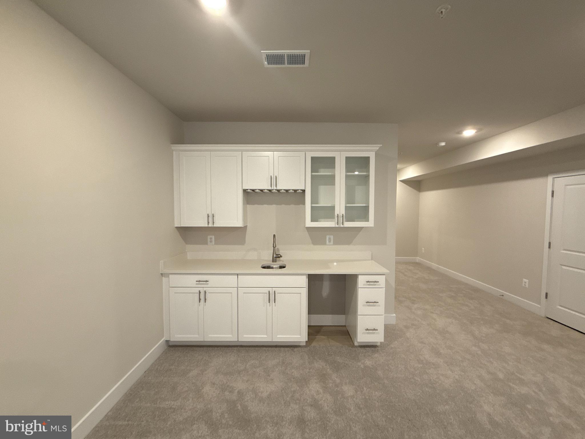 117 Stilly Way Annapolis, MD 21403 - Photo 16 of 21 a kitchen with white cabinets and sink