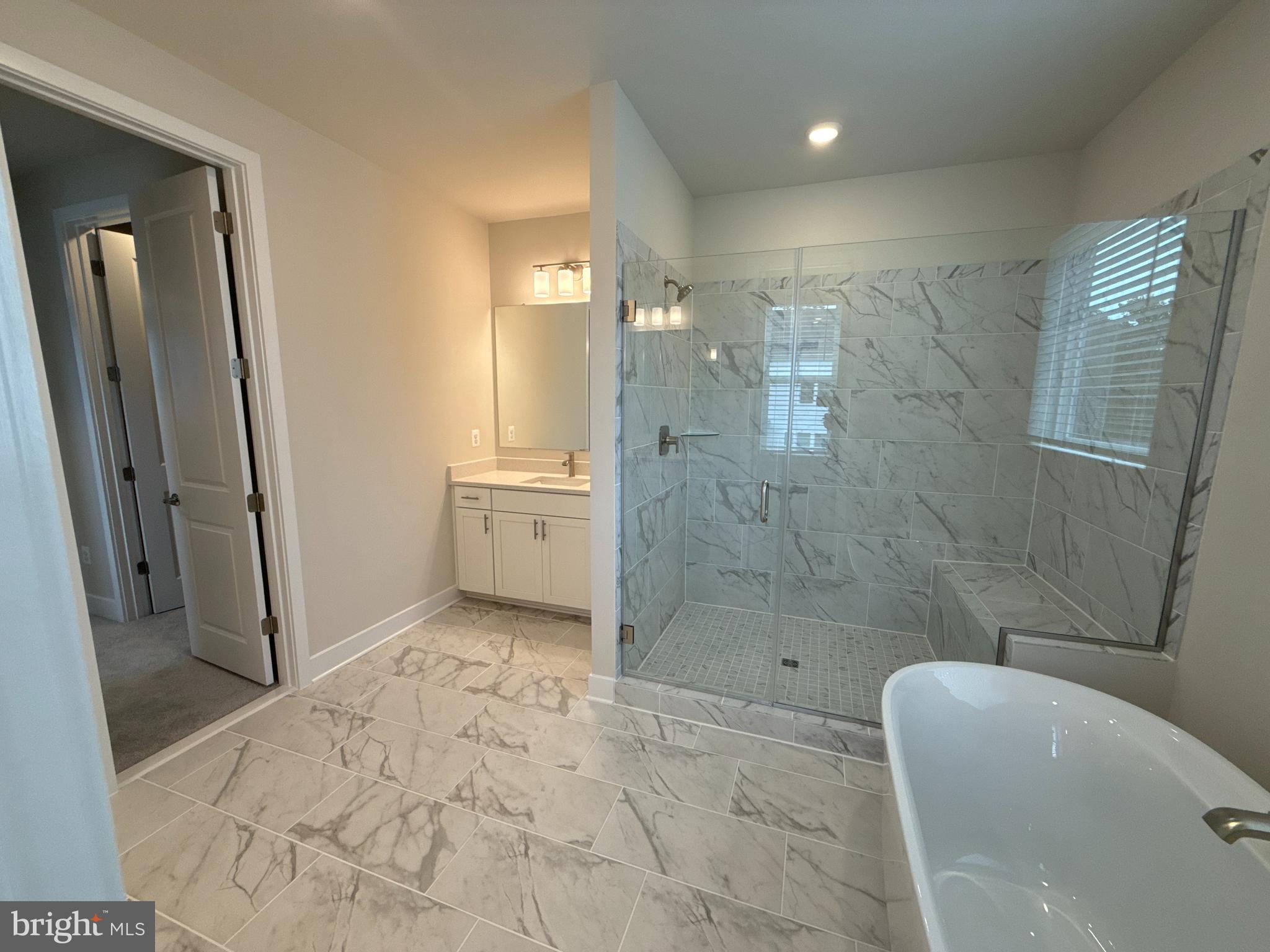 117 Stilly Way Annapolis, MD 21403 - Photo 9 of 21 a bathroom with a granite countertop sink a toilet and shower