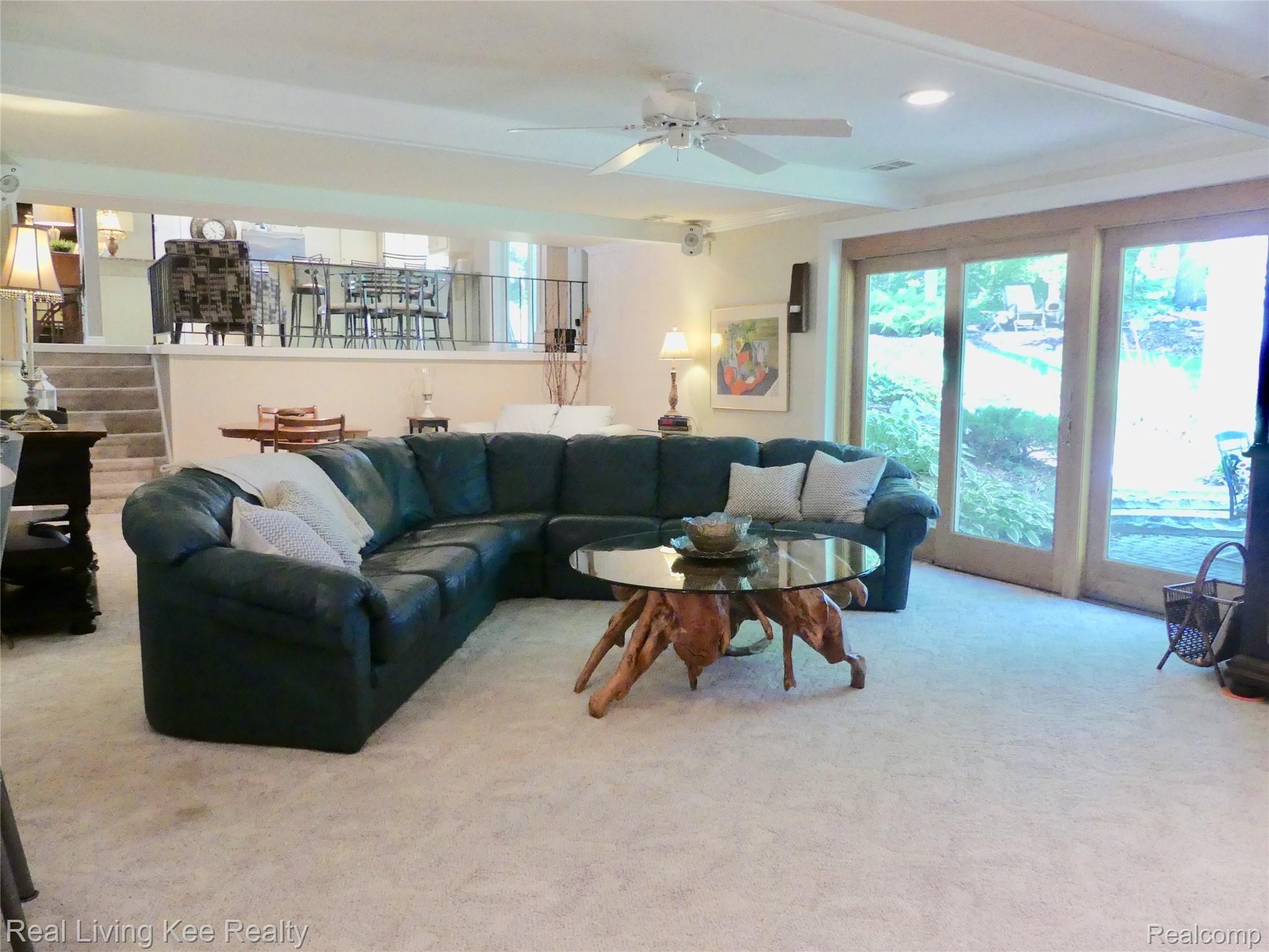 219 Beechview Drive Rochester, MI 48306 - Photo 15 of 64 Family room with doorwall to patio and stairs to kitchen