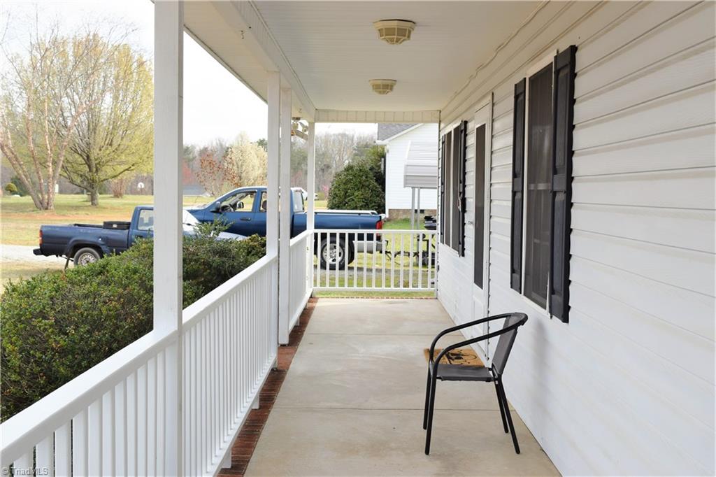 196 Lawrence Road Stokesdale, NC 27357 - Photo 18 of 24 Covered front porch