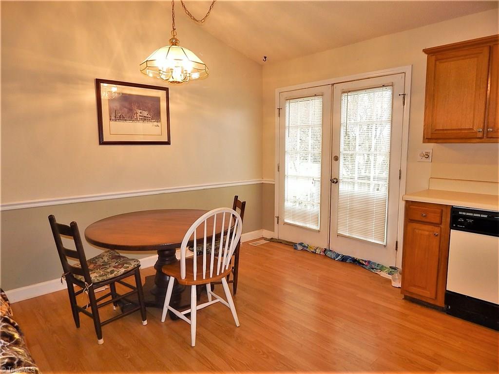 196 Lawrence Road Stokesdale, NC 27357 - Photo 6 of 24 Dining area with door to deck