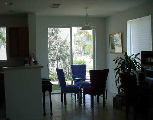 3104 Laurel Ridge Circle Riviera Beach, FL 33404 - Photo 3 of 7 a view of a dining room with furniture window and outside view