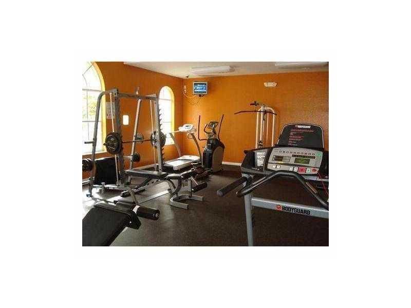 3104 Laurel Ridge Circle Riviera Beach, FL 33404 - Photo 6 of 7 a picture of a room with gym equipment
