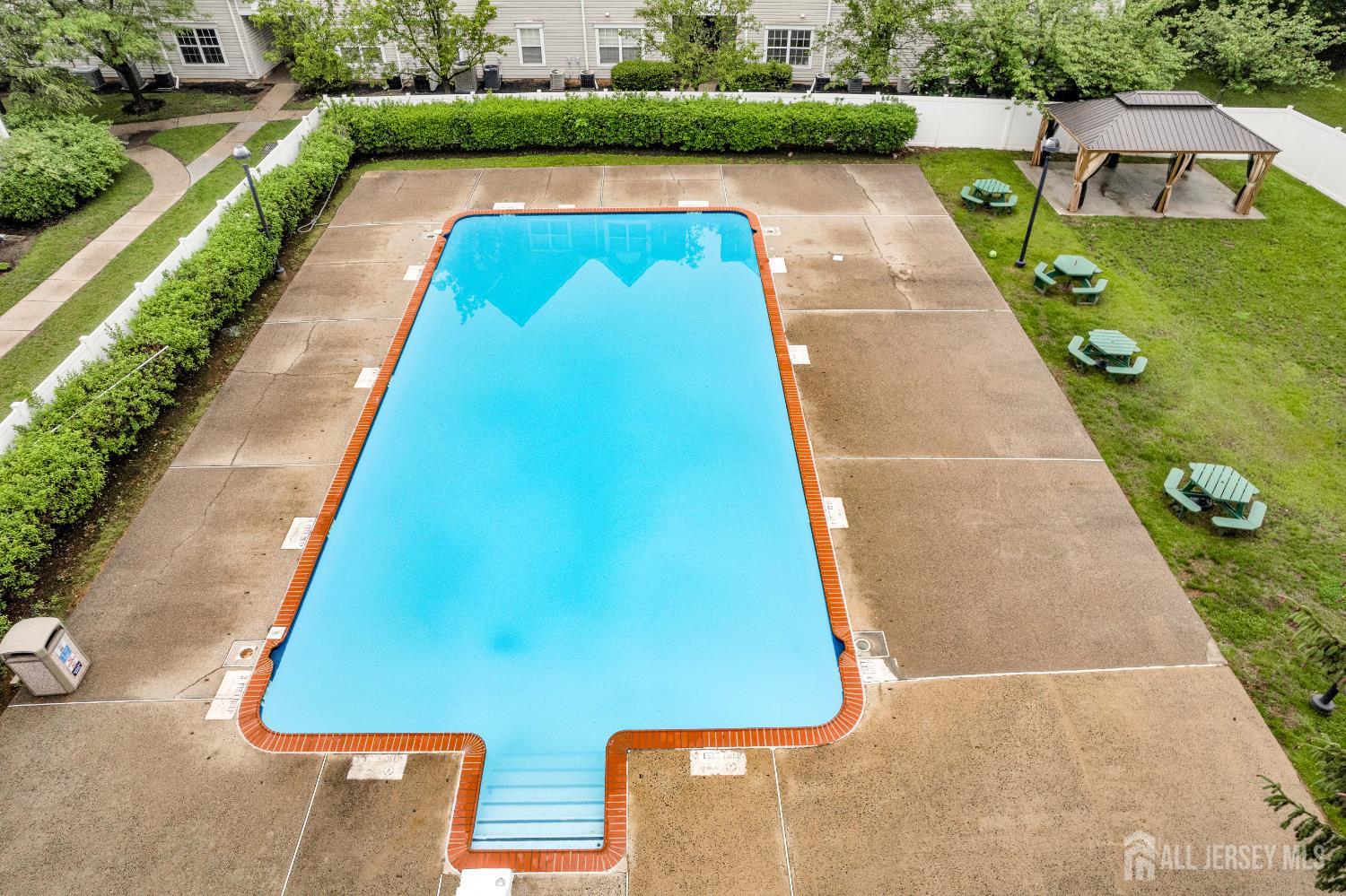 299 Prestwick Way Edison, NJ 08820 - Photo 4 of 7 a view of swimming pool with a yard
