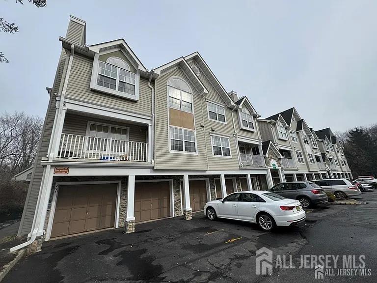299 Prestwick Way Edison, NJ 08820 - Photo 7 of 7 a front view of a house with parking space