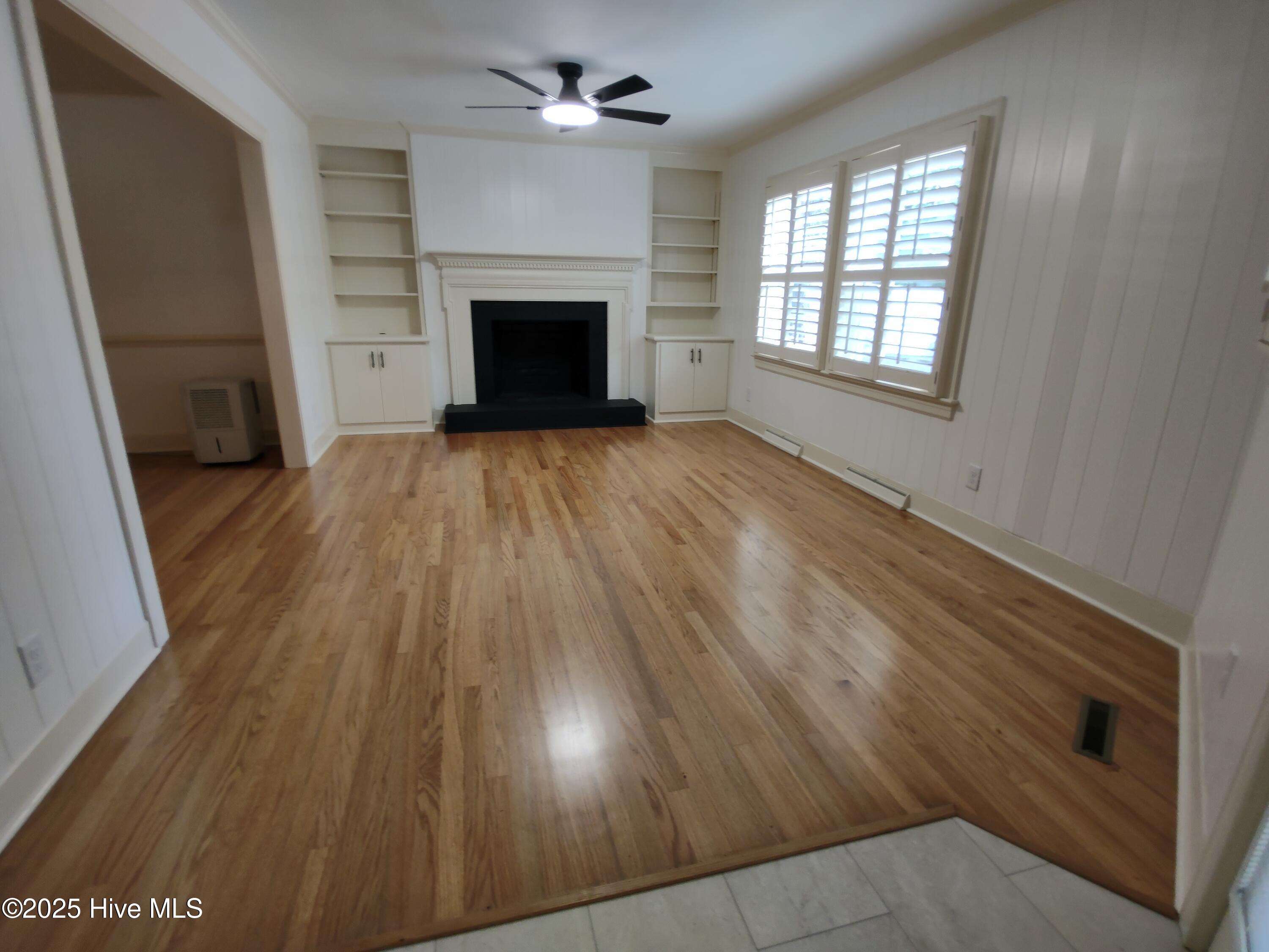 1109 Treemont Road Northwest Wilson, NC 27896 - Photo 2 of 20 back living room/ den